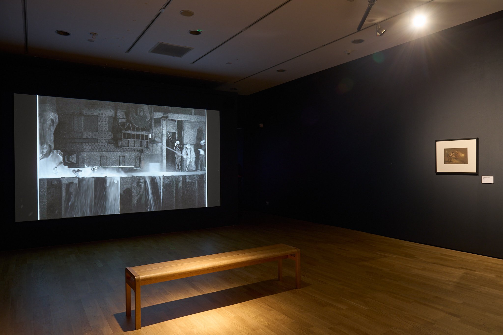 Film screening room with bench at Wolverhampton Art Gallery.