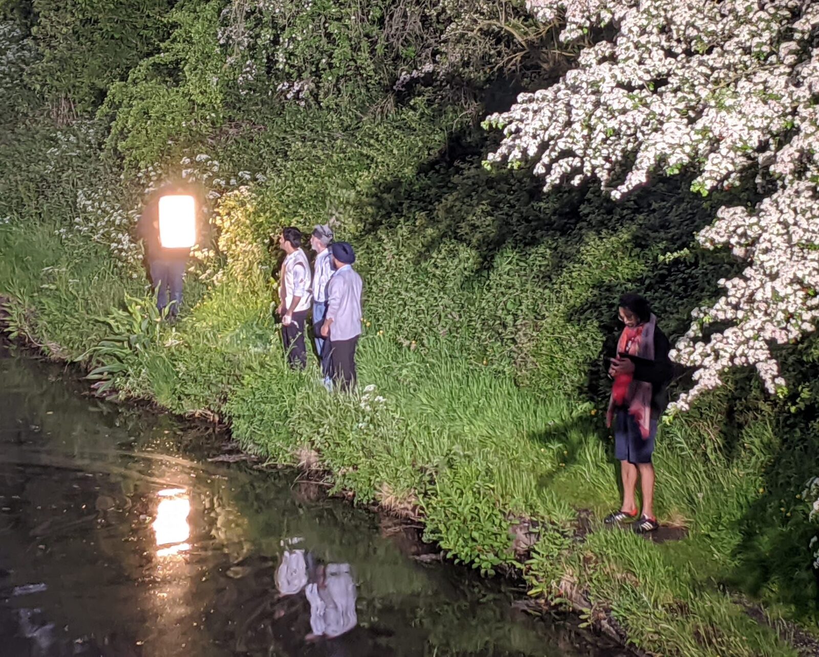 Cast on the canal bank at night with full lighting rig