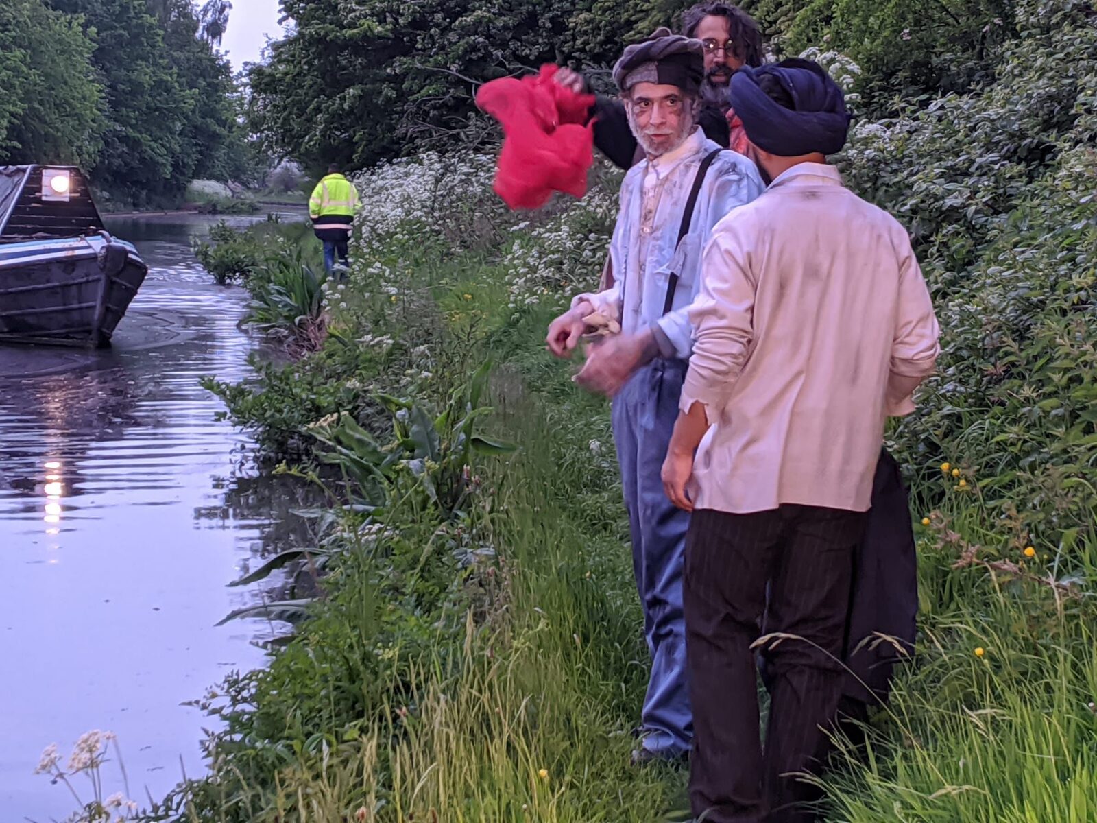 Director briefing cast on the canal towpath